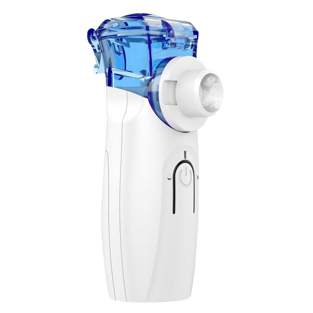 Handheld nebulizer releasing mist from mouthpiece during operation