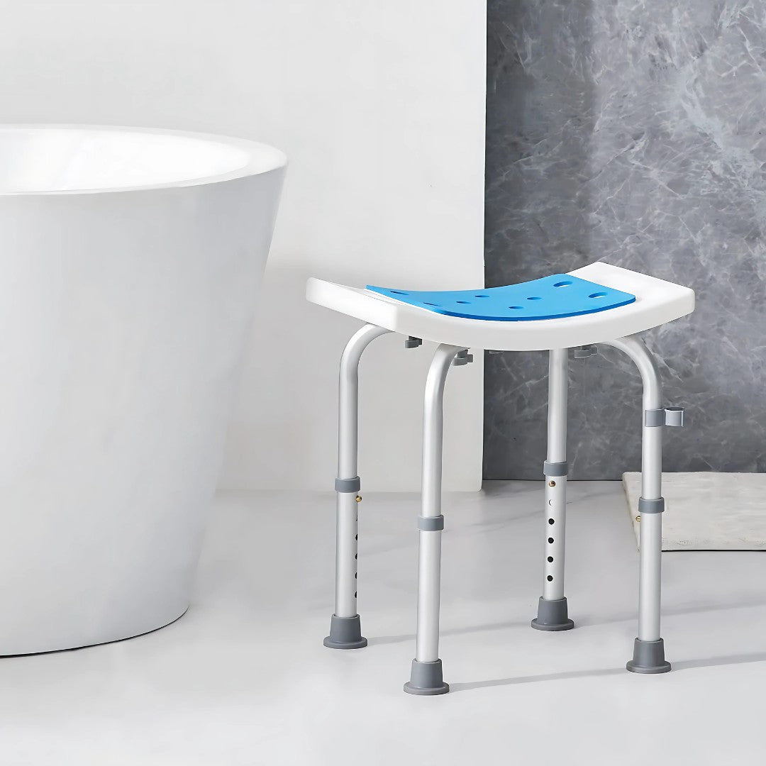 Shower chair placed beside a bathtub in a minimalist bathroom with gray and white interior design.